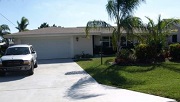 Example of a Cape Coral Gulf access waterfront home in the Cape Coral Yacht Club neighborhood behind a bridge