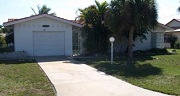 Example of a Cape Coral Gulf access waterfront home in the Cape Coral Yacht Club neighborhood behind a bridge